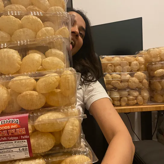 Shruti holding many paanis in preparation for our Paani Puri party.